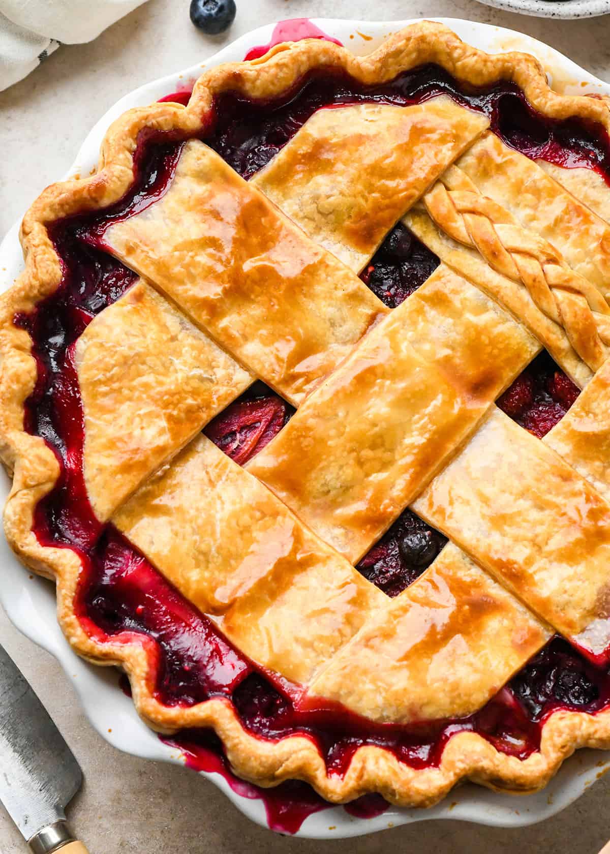 Mixed Berry Pie in a pie dish with a lattice crust