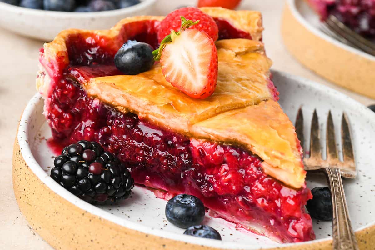 a slice of Mixed Berry Pie on a plate 