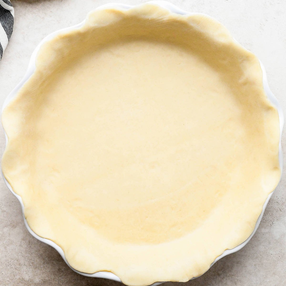 a pie crust formed into a pie plate