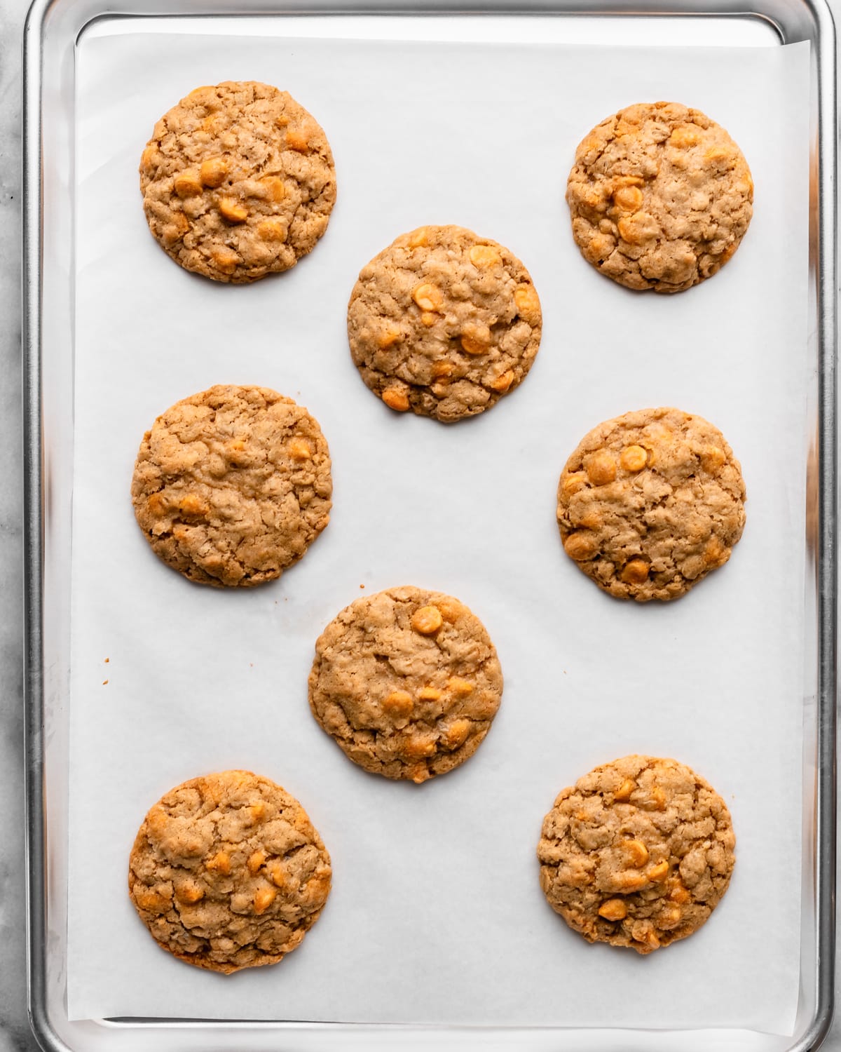 8 Oatmeal Butterscotch Cookies on a baking sheet after baking