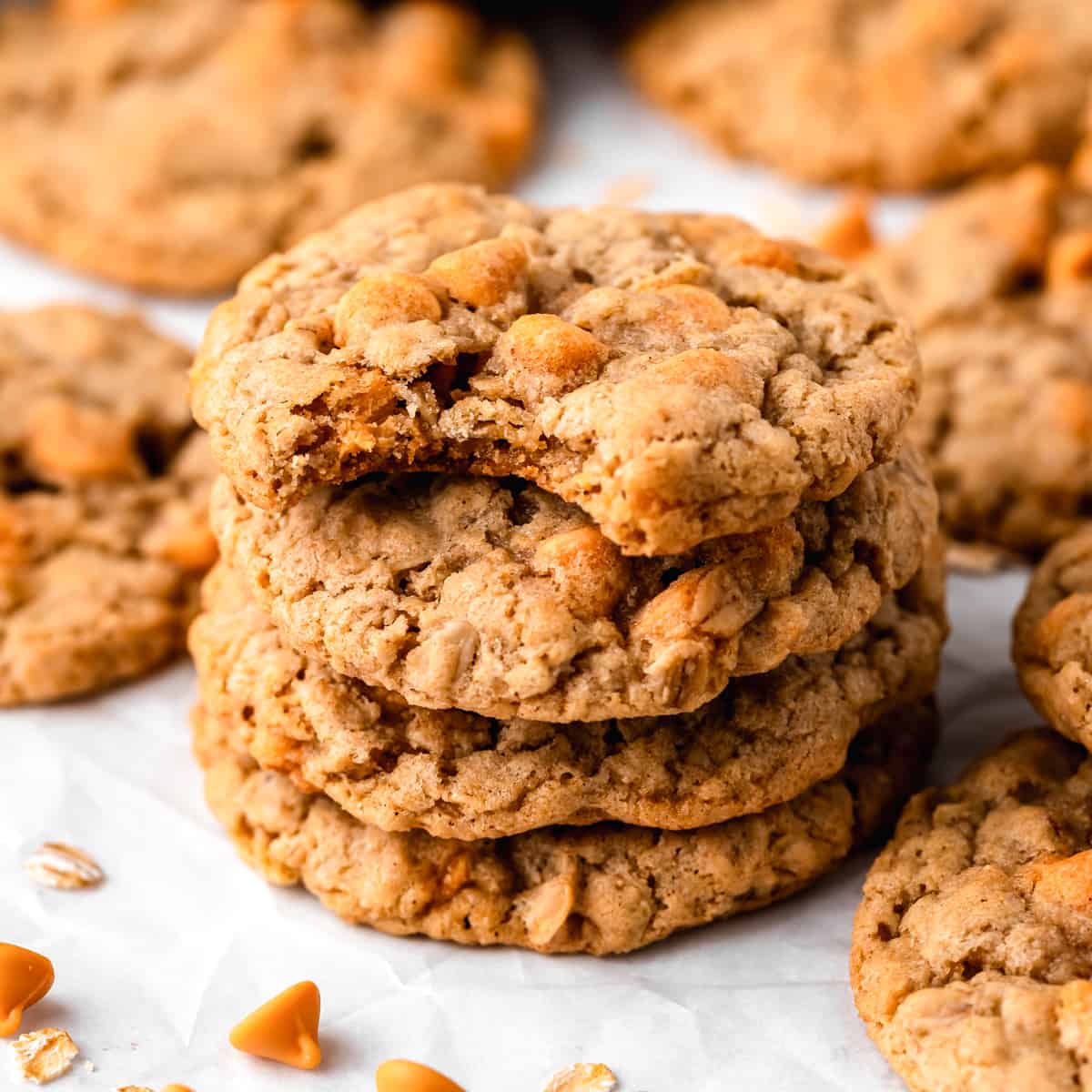 a stack of 4 Oatmeal Butterscotch Cookies, the top one has a bite taken out of it