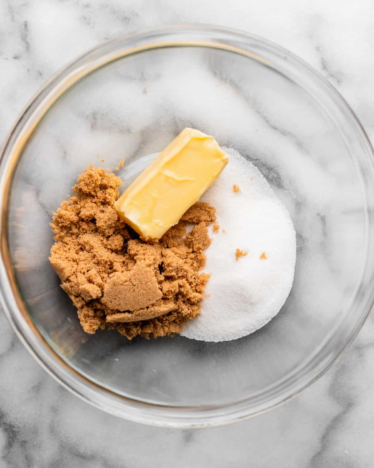 how to make Oatmeal Butterscotch Cookies - butter, brown sugar and white sugar in a bowl before mixing