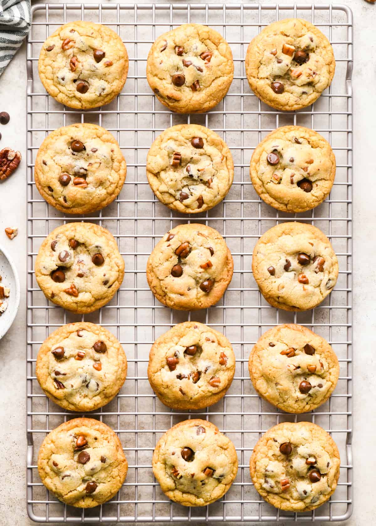 15 Chocolate Chip Pecan Cookies on a wire cooling rack