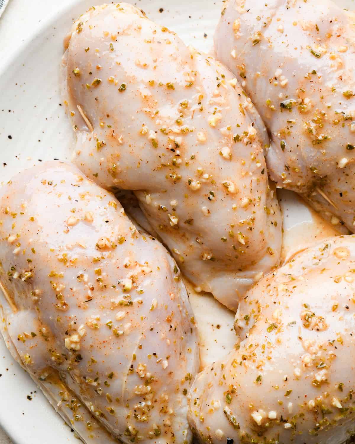 4 Feta Stuffed Chicken Breasts stuffed with filling and closed with a toothpick