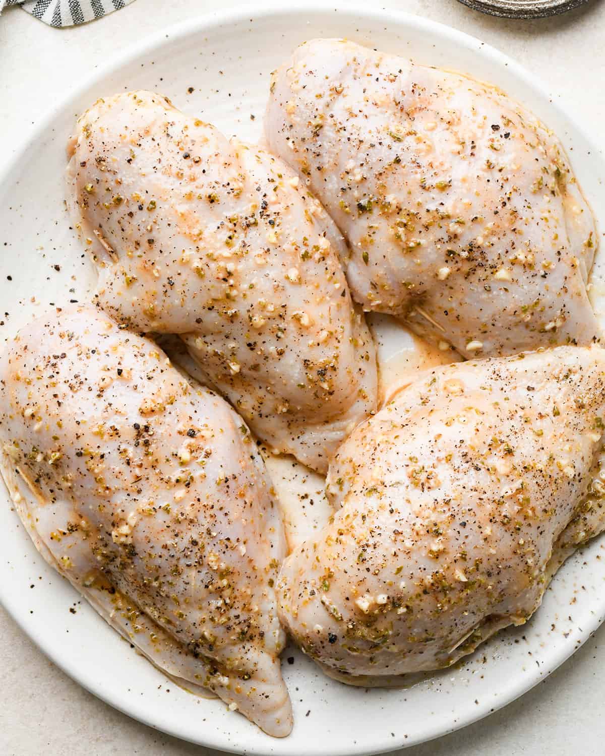 4 Feta Stuffed Chicken Breasts stuffed with filling. sprinkled with salt and pepper and closed with a toothpick