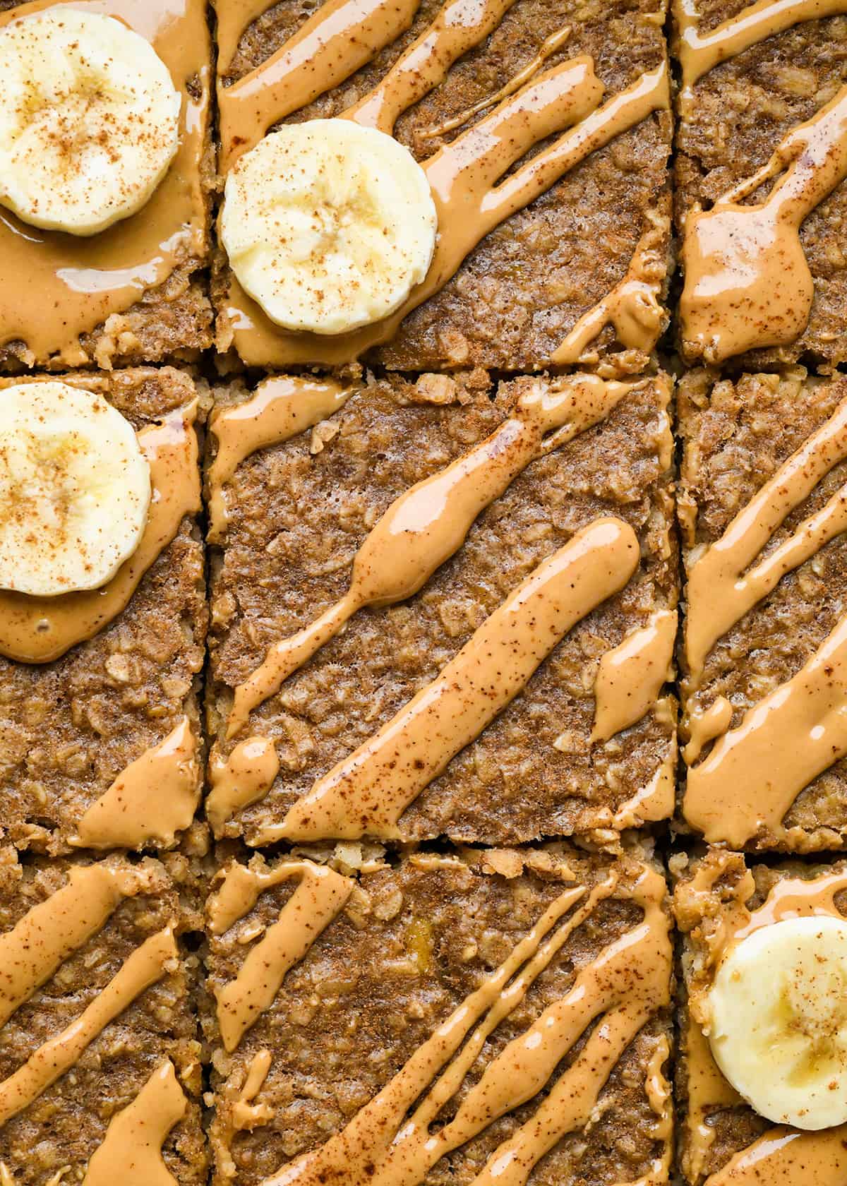 Peanut Butter Banana Baked Oatmeal in a baking dish cut into 9 pieces 