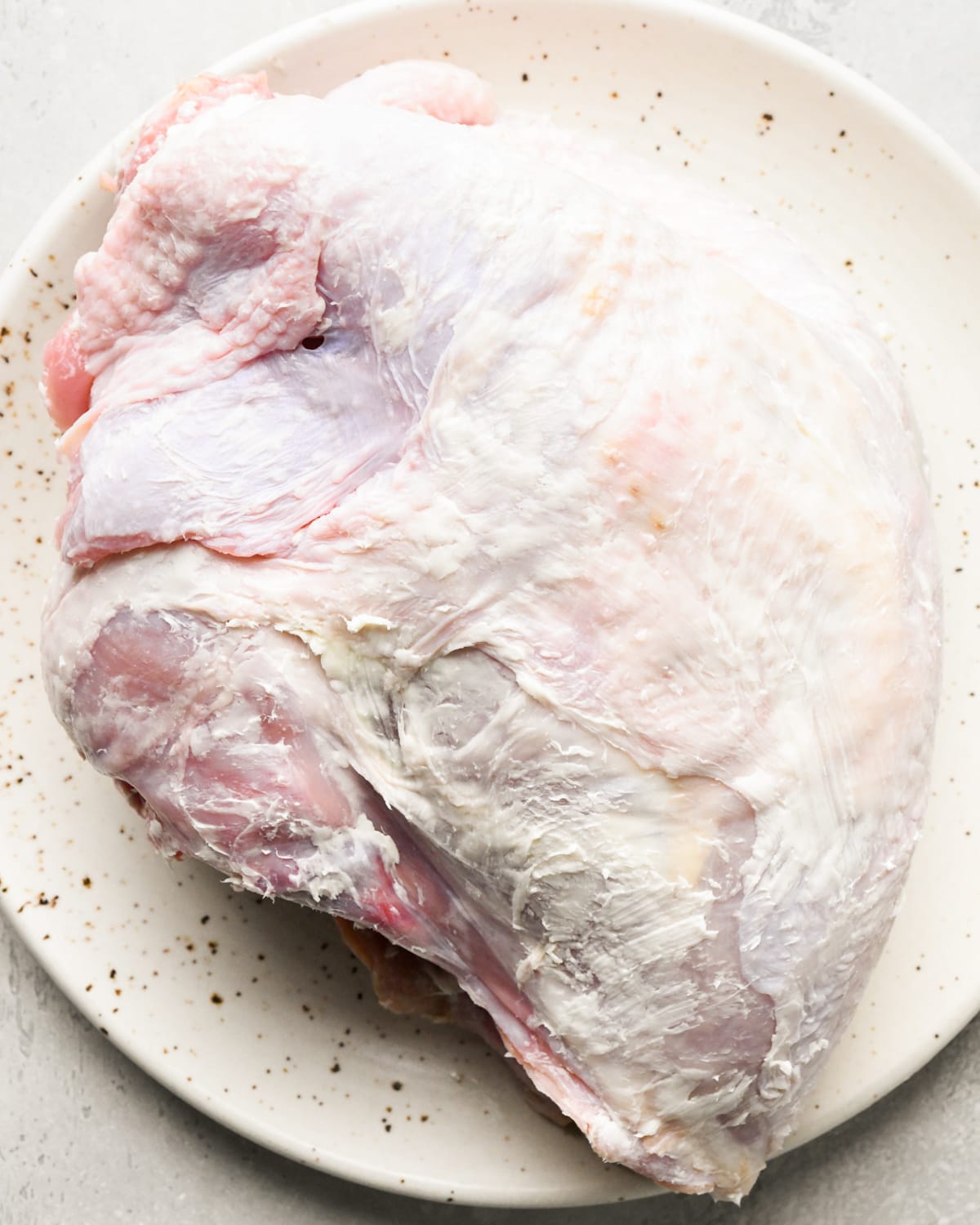 turkey breast with butter under the skin on a plate