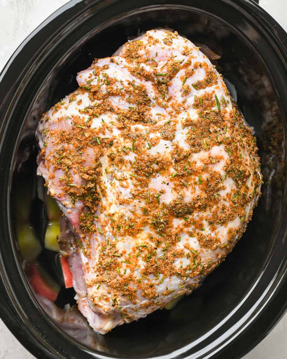 rubbed turkey breast in the container of a slow cooker before cooking