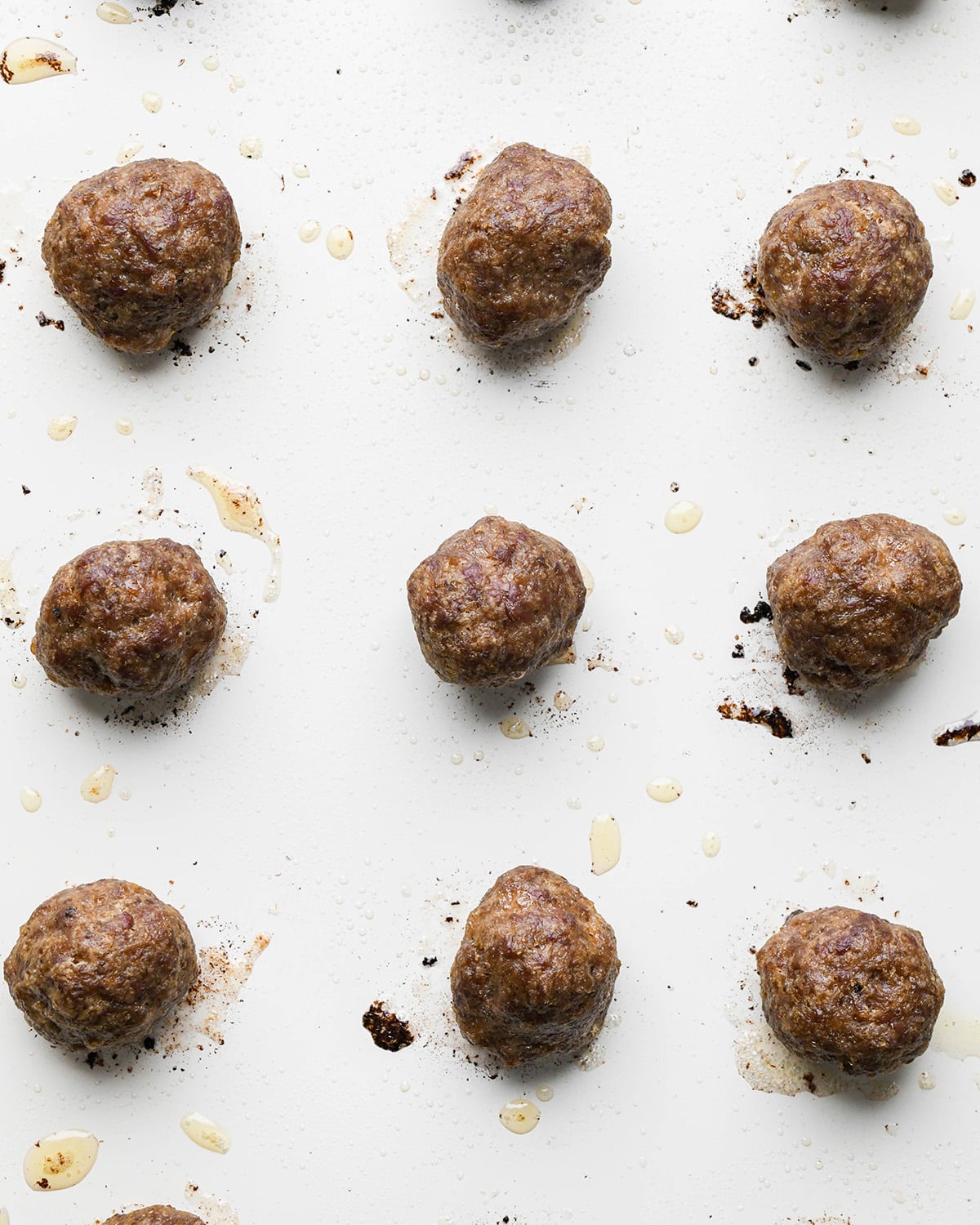 9 Asian Meatballs on a baking pan after baking