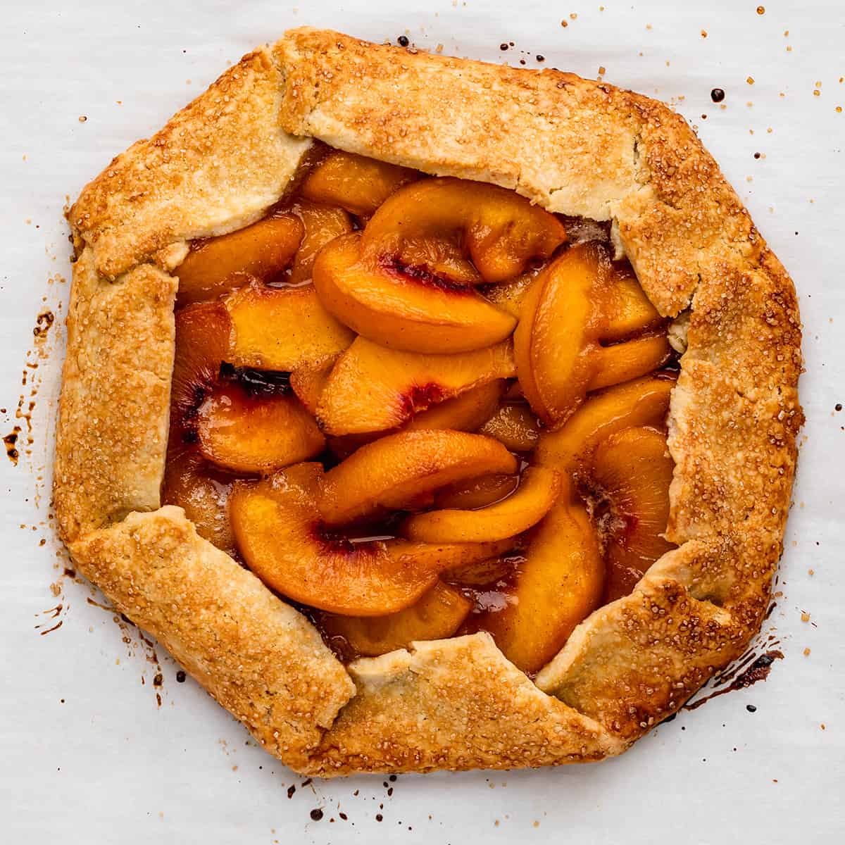 peach galette on a baking sheet after baking