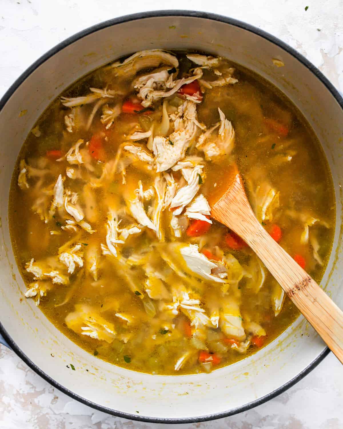 How to Make Chicken Noodle Soup - returning shredded chicken to the pot to cook