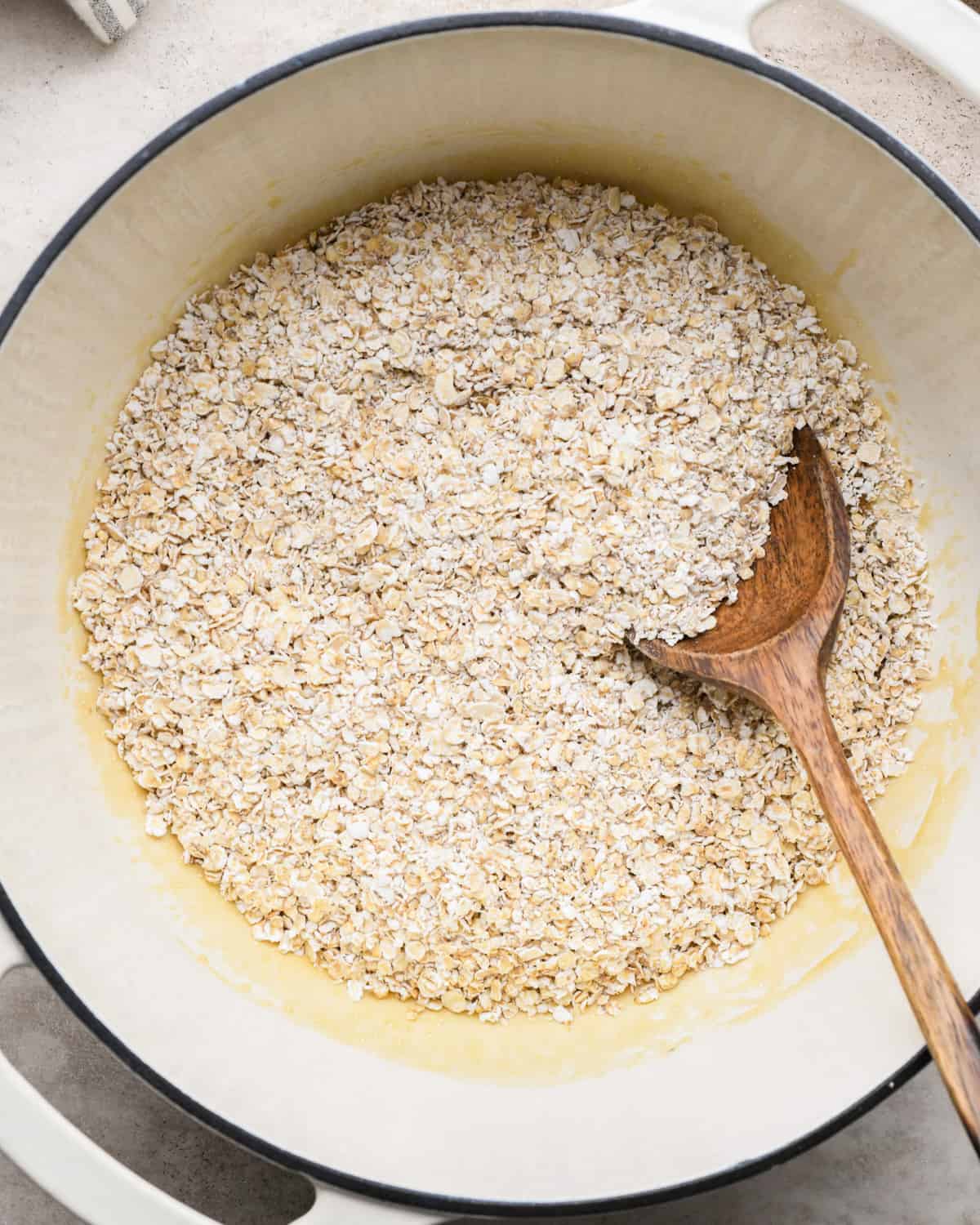 How to Make Granola Bars adding oatmeal before stirring