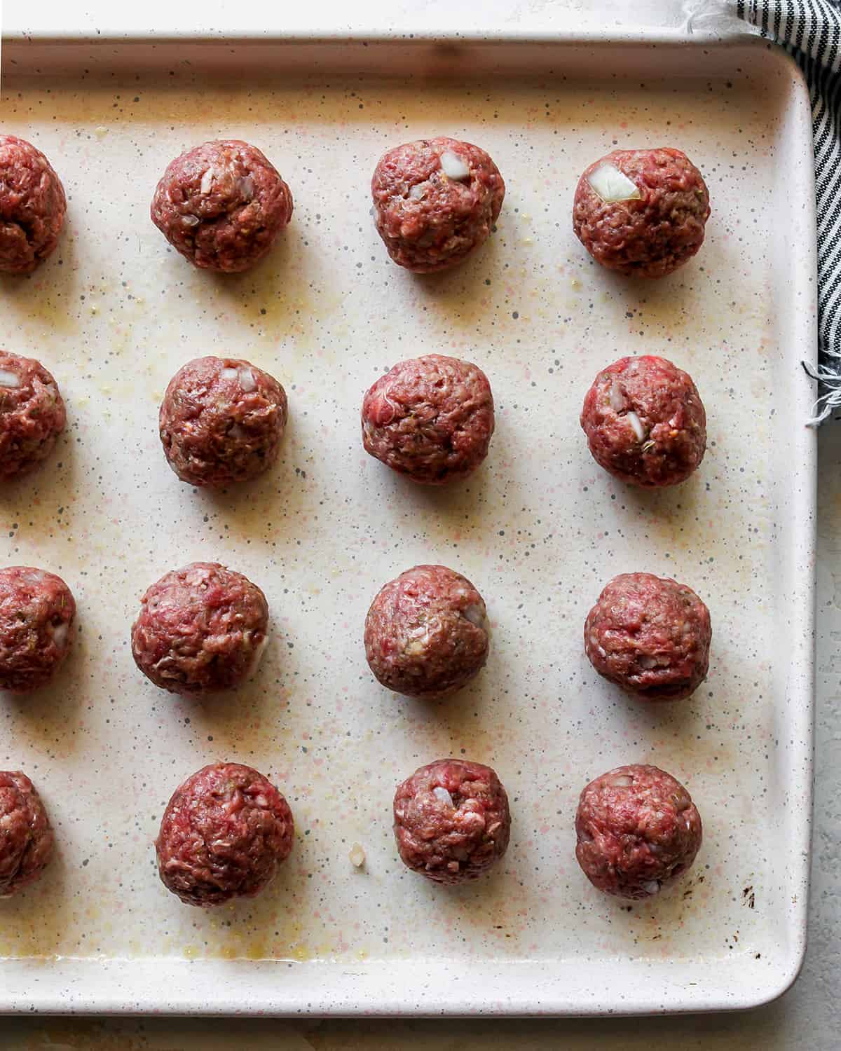 Greek Meatballs on a baking sheet before baking