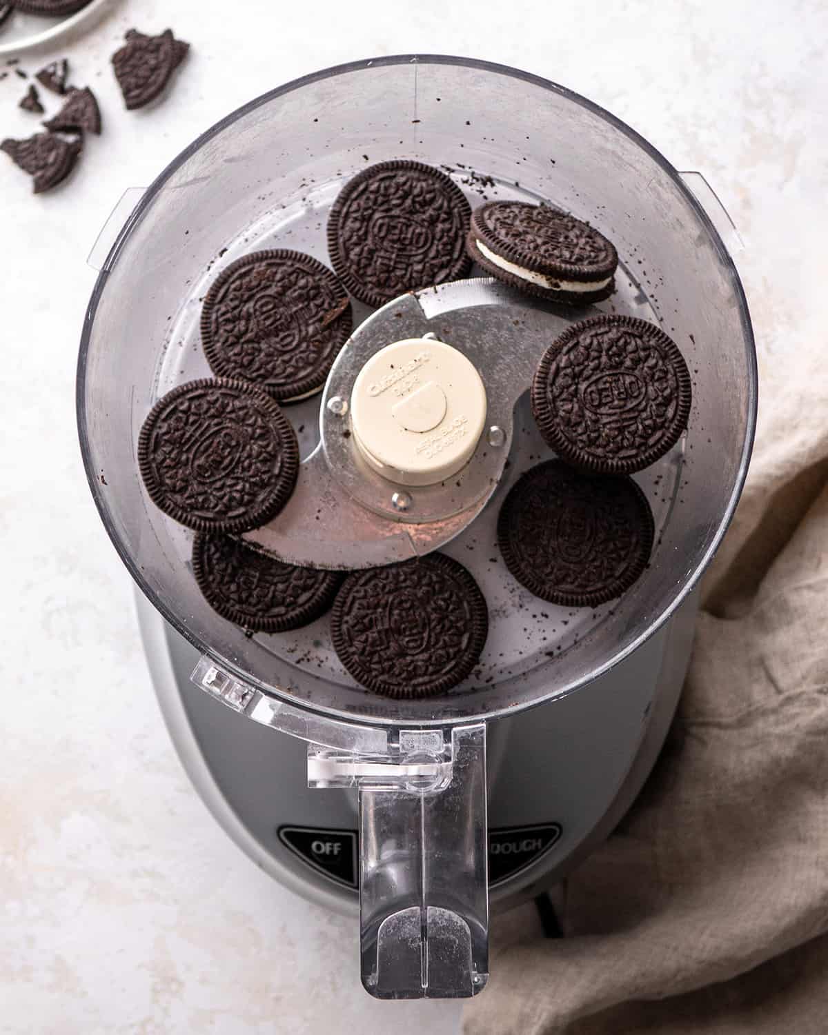 8 Oreos in a food processor before processing