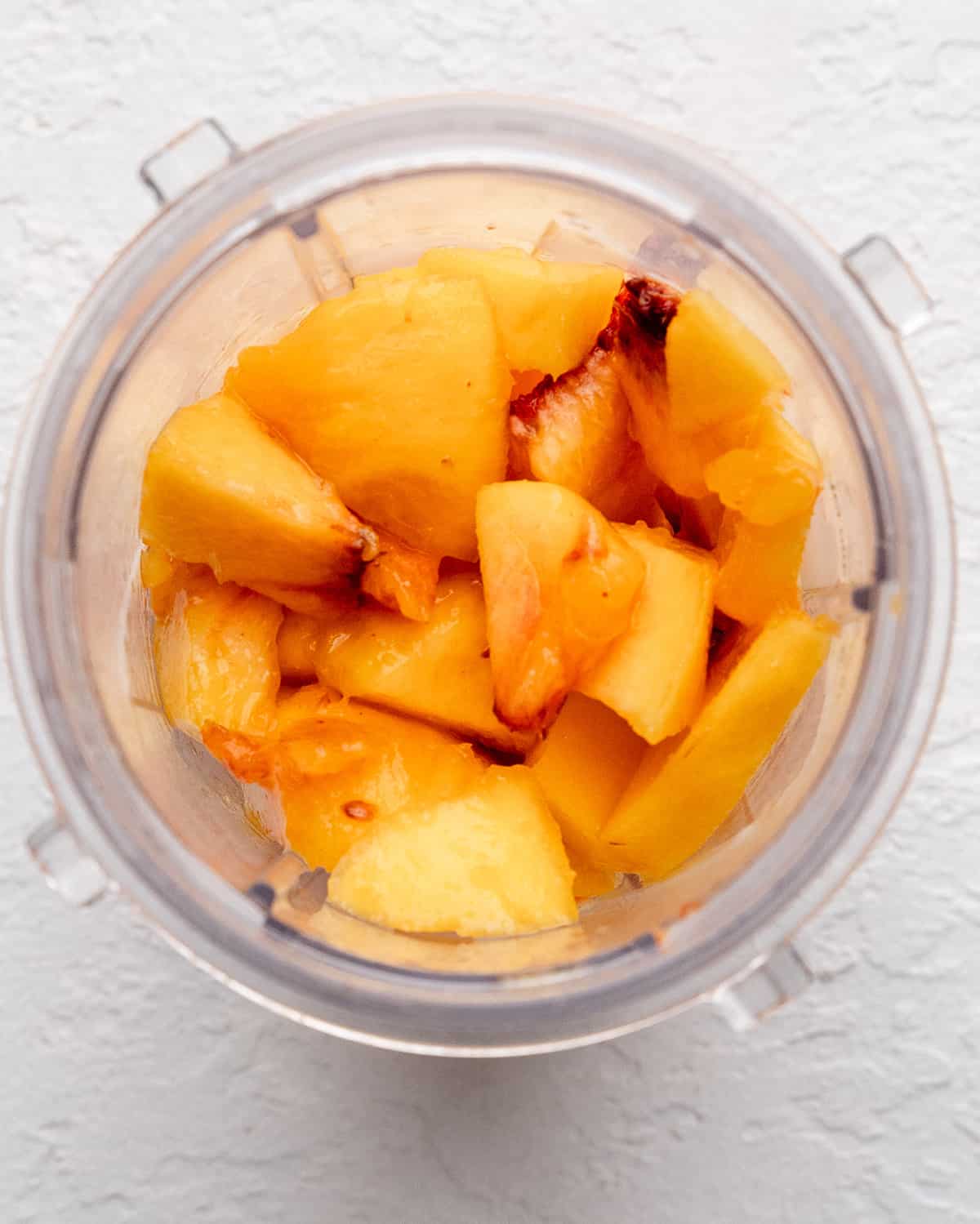 peaches in a blending container before blending