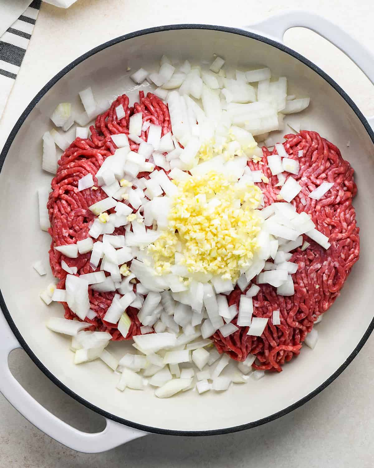 How to Make Sloppy Joes - ground beef, onion and garlic in a pan before cooking