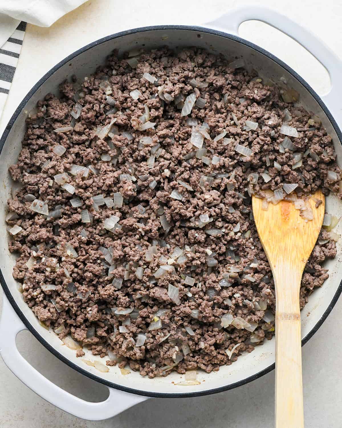 How to Make Sloppy Joes - onion, ground beef and garlic in a pan after cooking