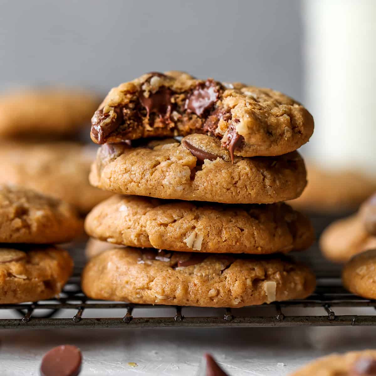 a stack of 4 Peanut Butter Oatmeal Cookies, the top one with a bite taken out of it
