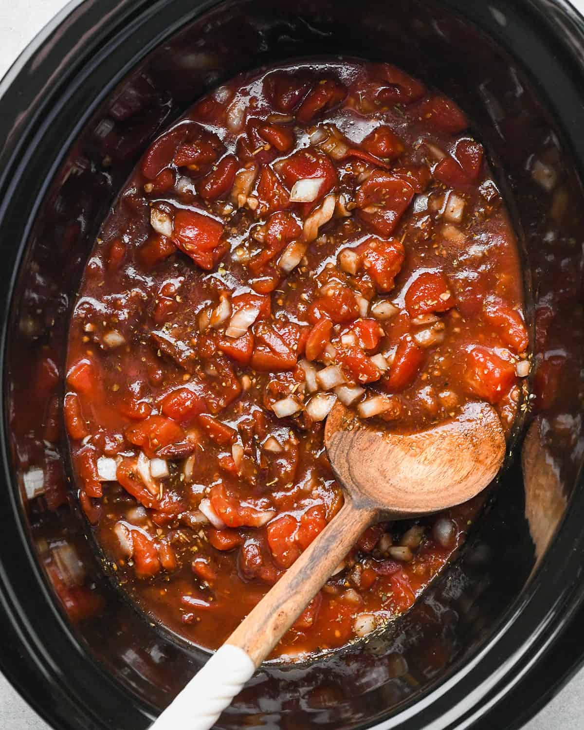 Slow Cooker Italian Chicken sauce ingredients in a crockpot after mixing