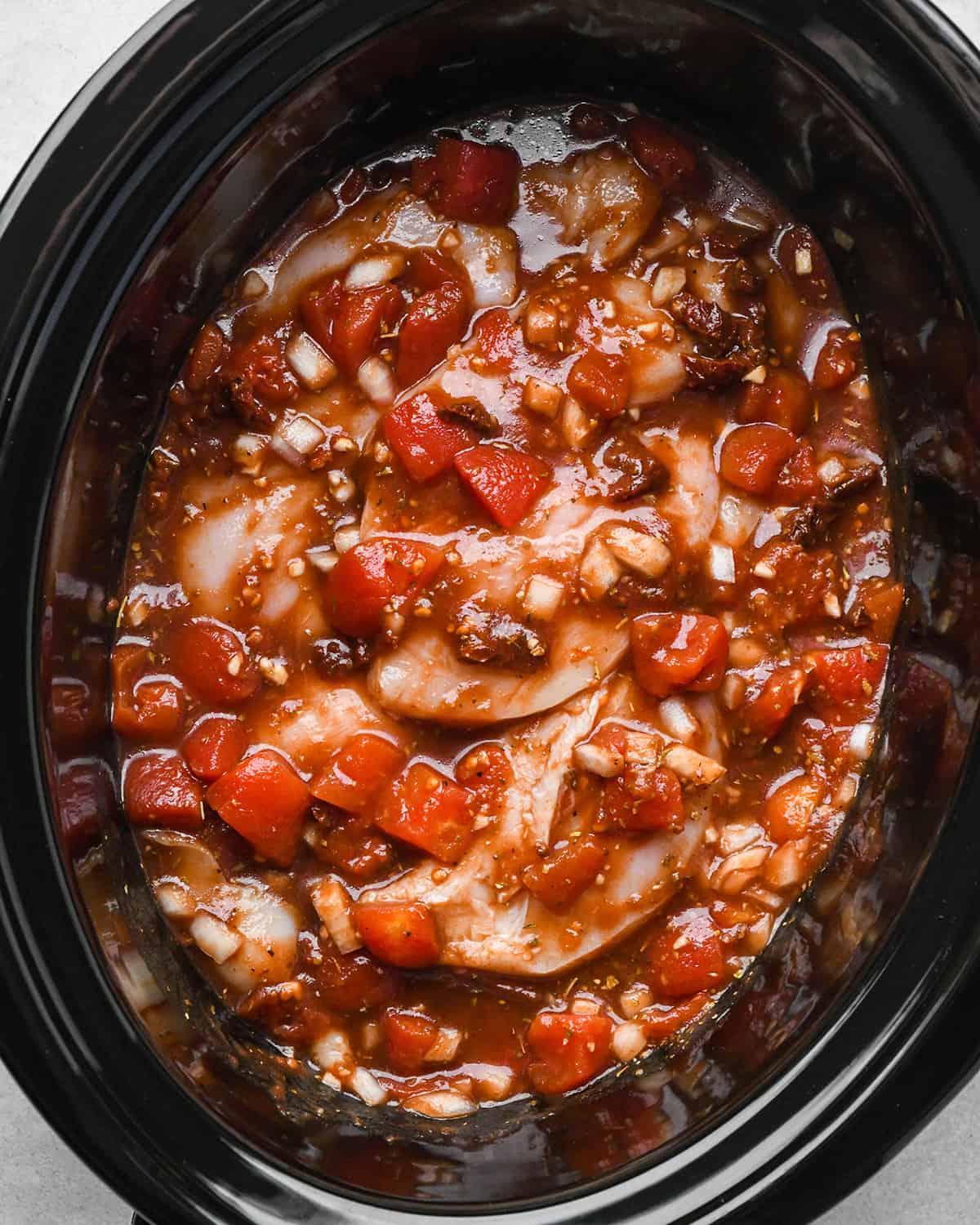 chicken breasts added to the sauce after mixing before cooking in this crockpot italian chicken recipe