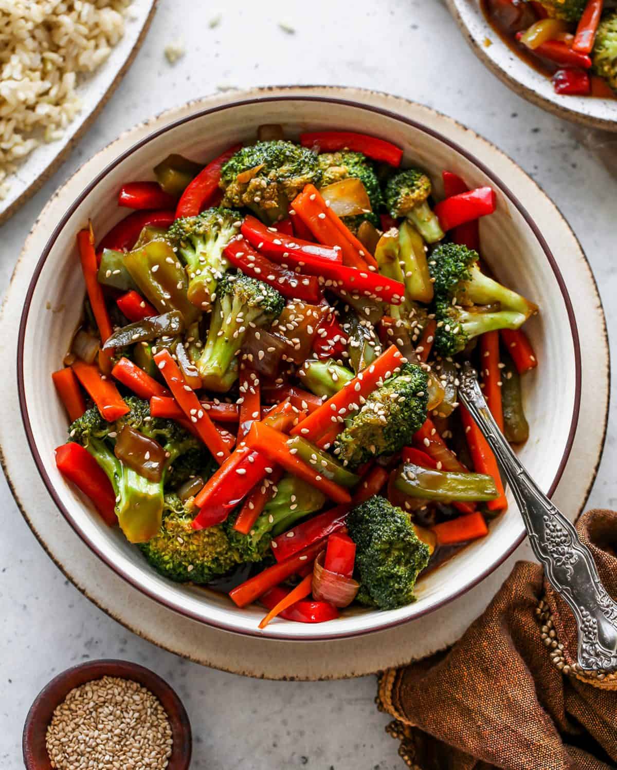 Stir Fry Vegetables in a bowl topped with sesame seeds