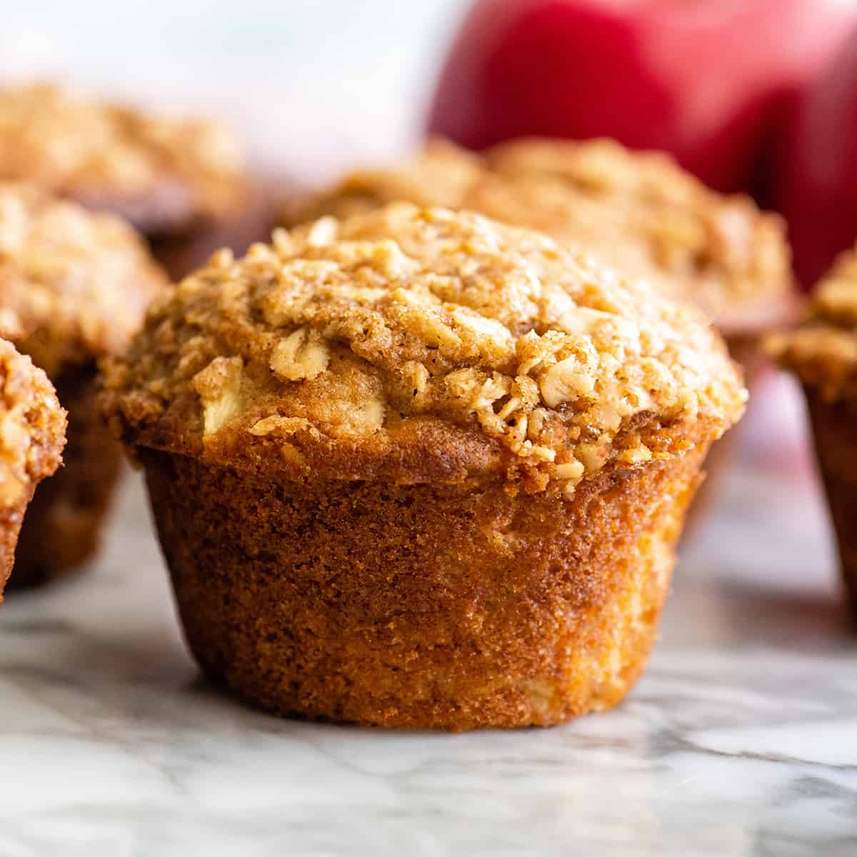 up close photo of a Cinnamon Apple Muffin with crumb topping