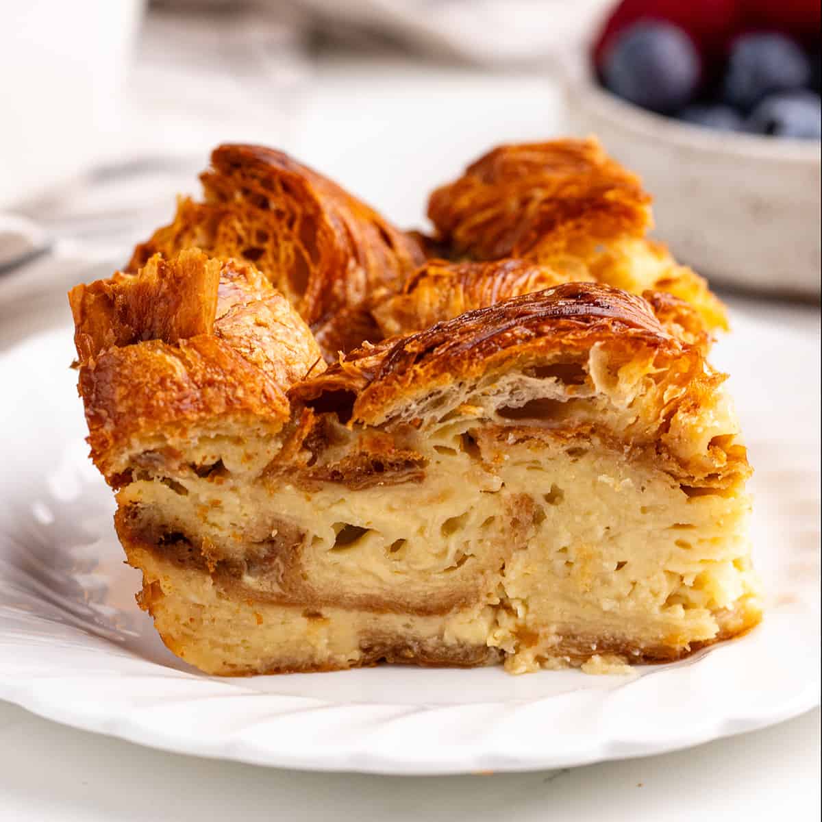 a slice of Croissant Bread Pudding on a plate