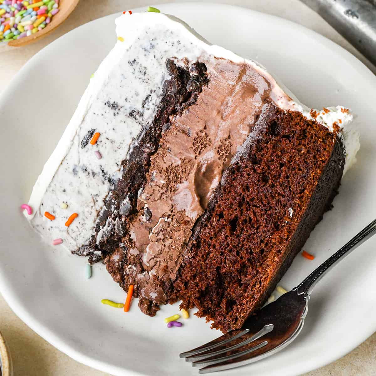 a slice of Ice Cream Cake on a plate with a fork