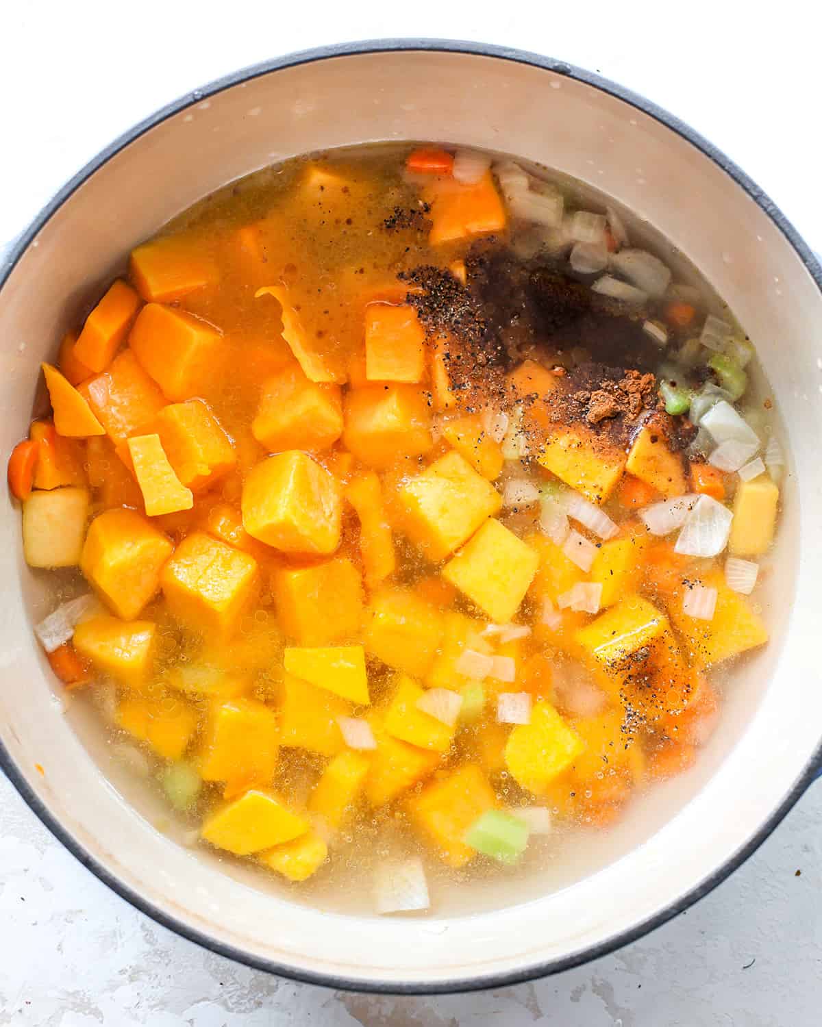 How to Make Butternut Squash Soup - adding squash and other ingredients before stirring