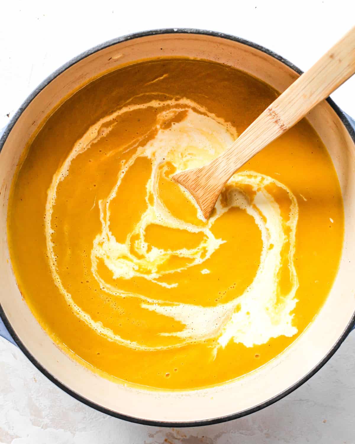 How to Make Butternut Squash Soup adding cream before stirring