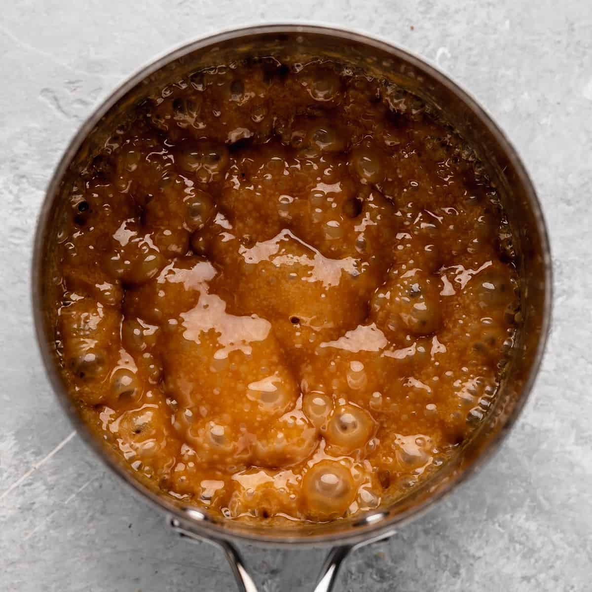 caramel sauce mixture boiling in a saucepan