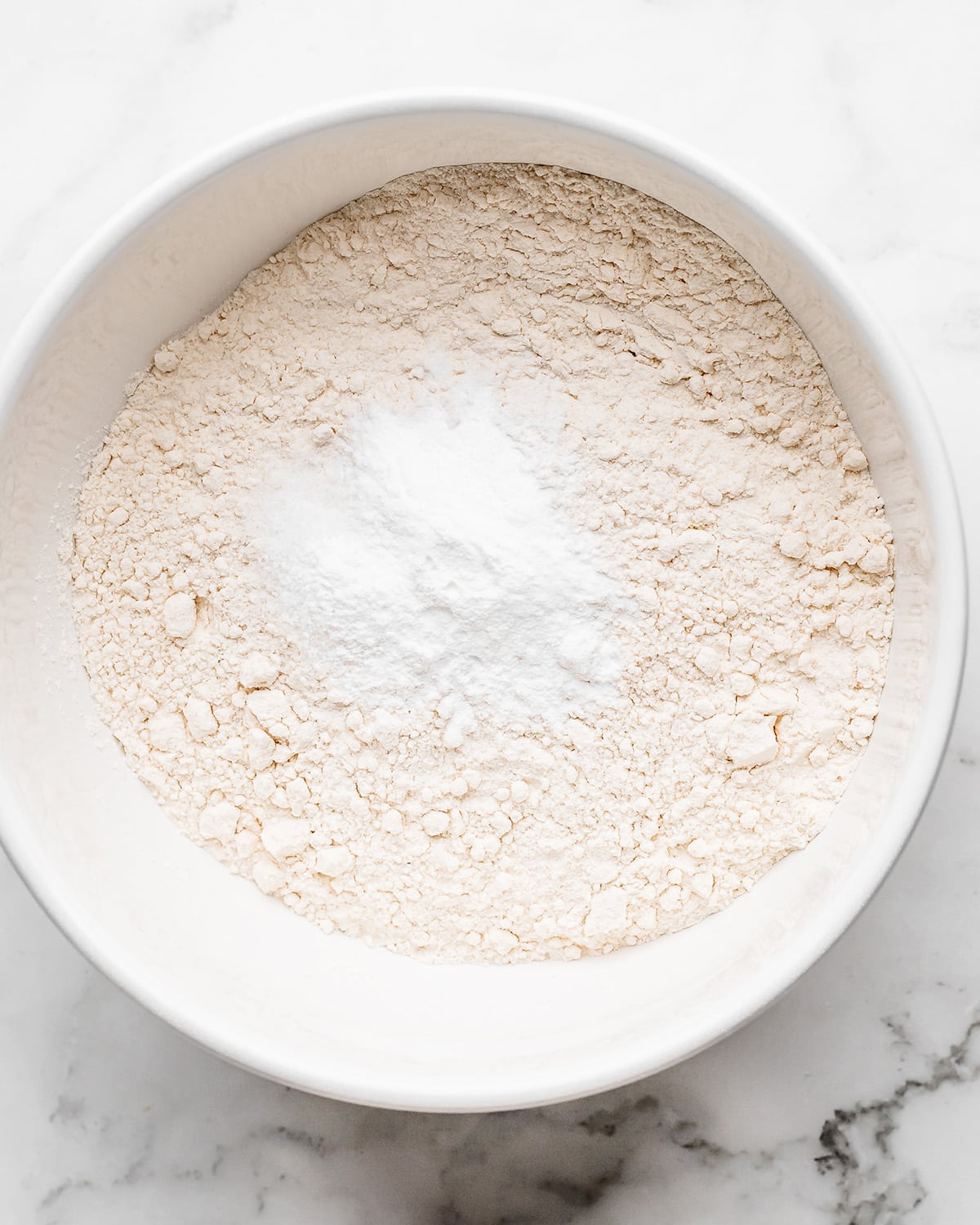 how to make coconut cake- dry ingredients in a bowl before mixing