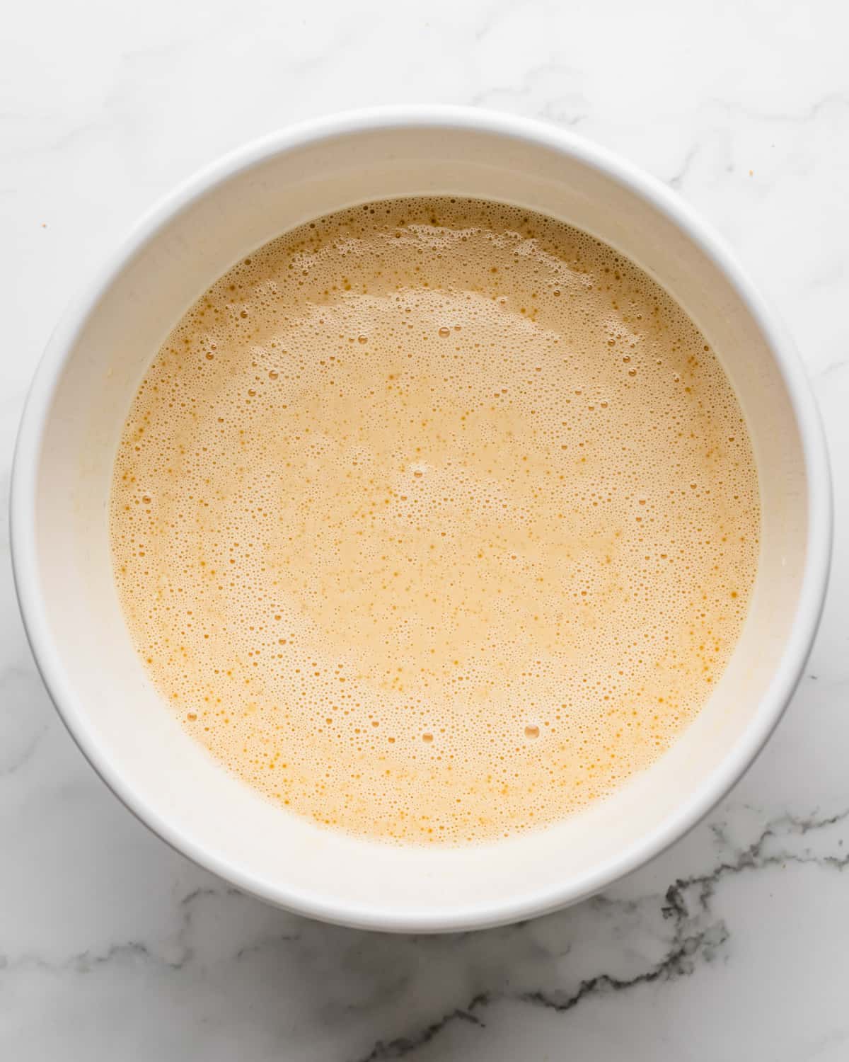 How to Make Croissant Bread Pudding - final custard mixture in a bowl