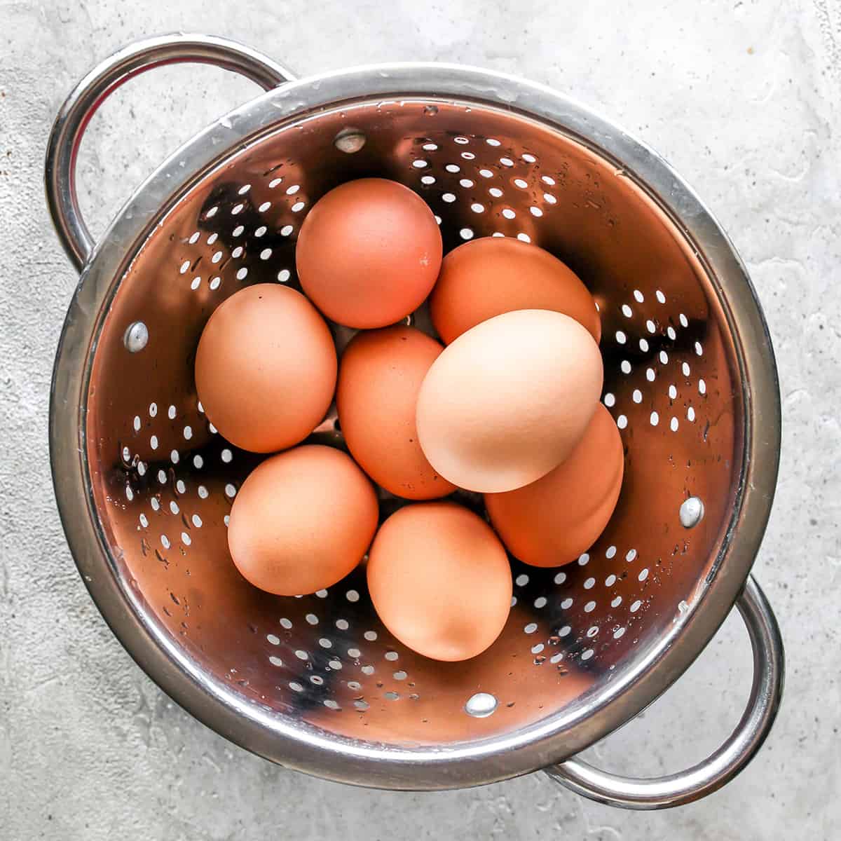 hard boiled eggs cooling in a colander