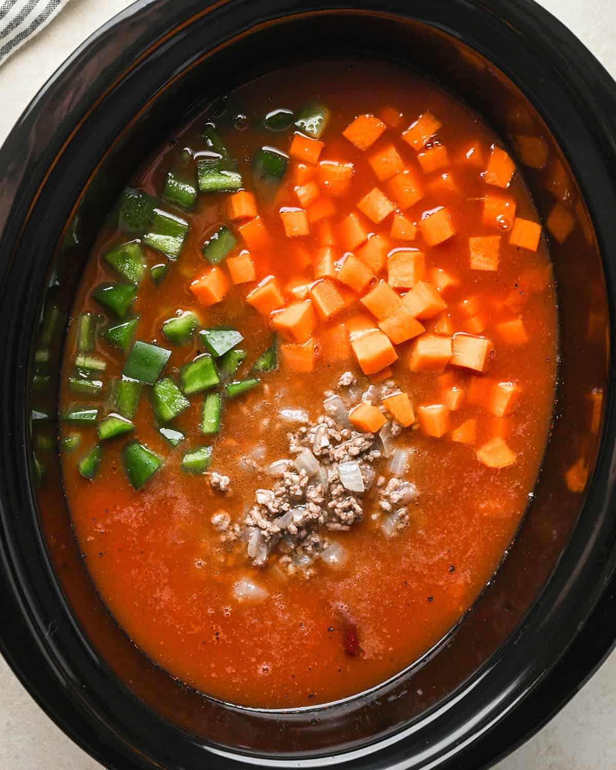 How to Make Hamburger Soup - adding vegetables to the crock pot