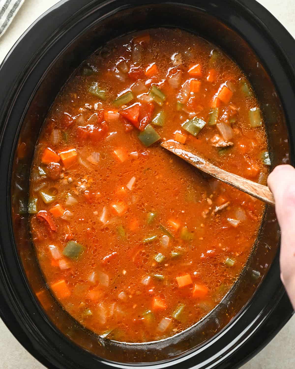 How to Make Hamburger Soup - stirring in a crock pot after cooking