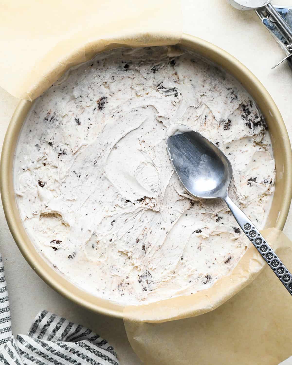 assembling an ice cream cake - ice cream in a cake pan after spreading out