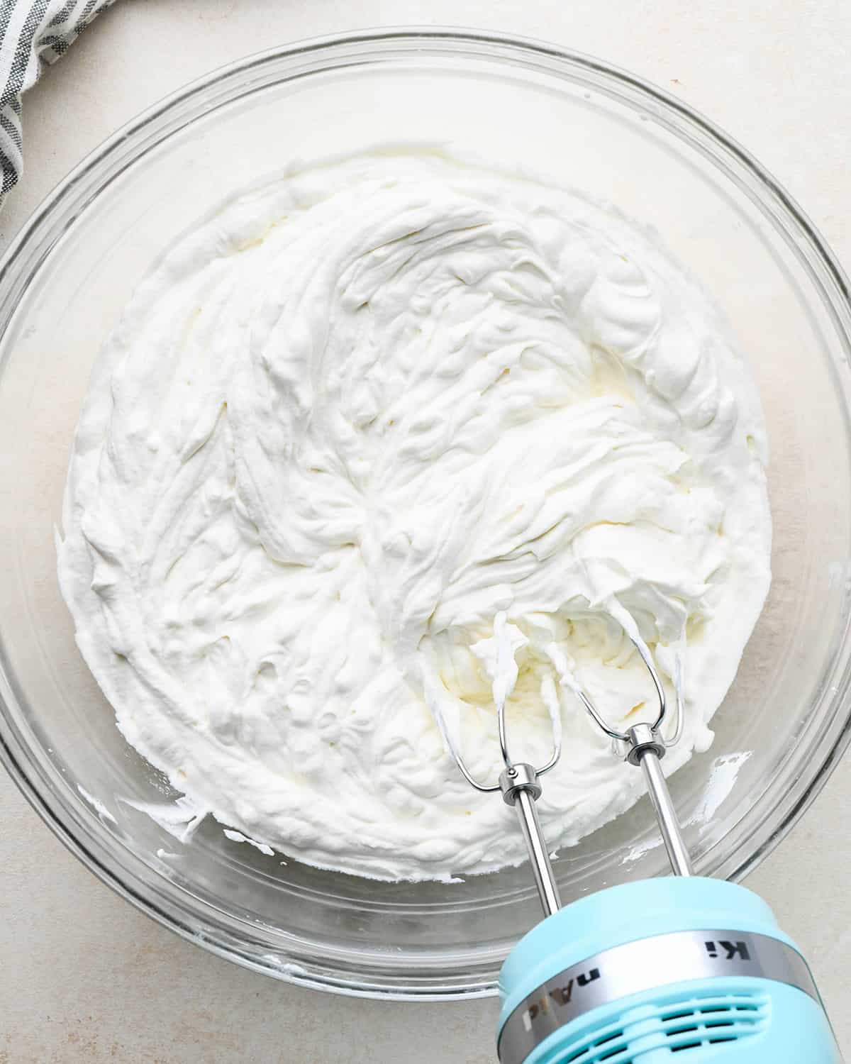 How to Make an Ice Cream Cake - whipped cream ingredients in a bowl after whipping
