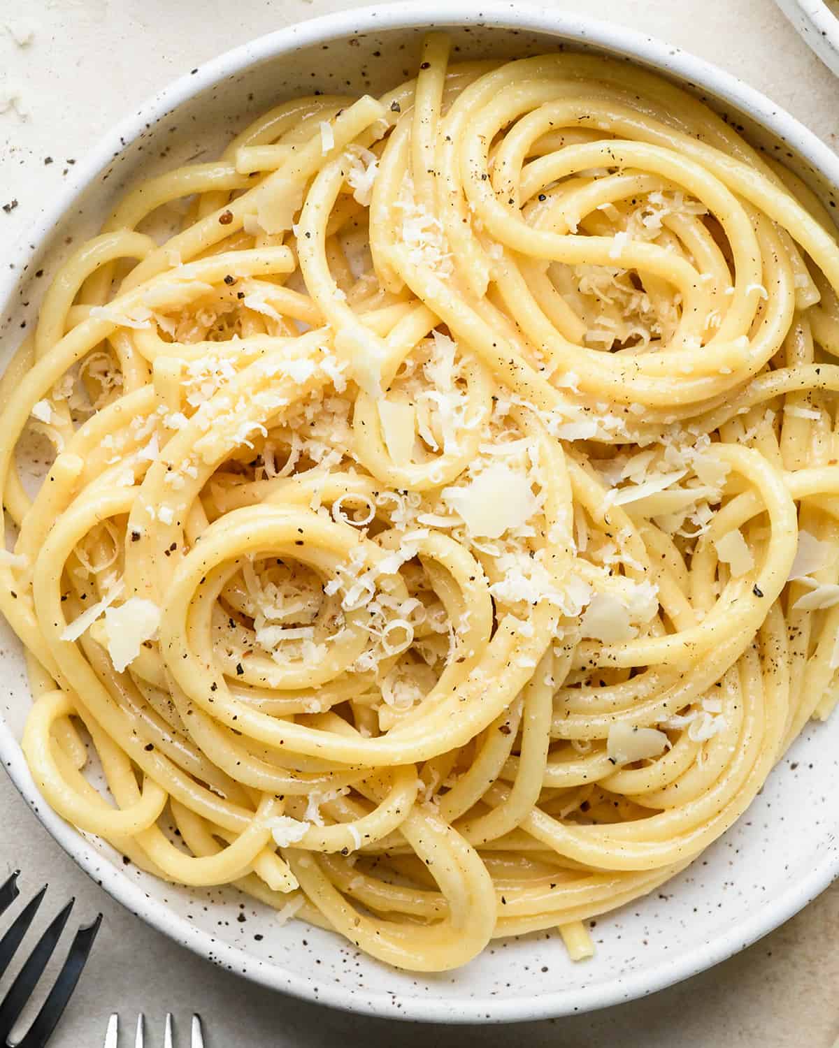 Parmesan Pasta on a plat topped with parmesan cheese and pepper