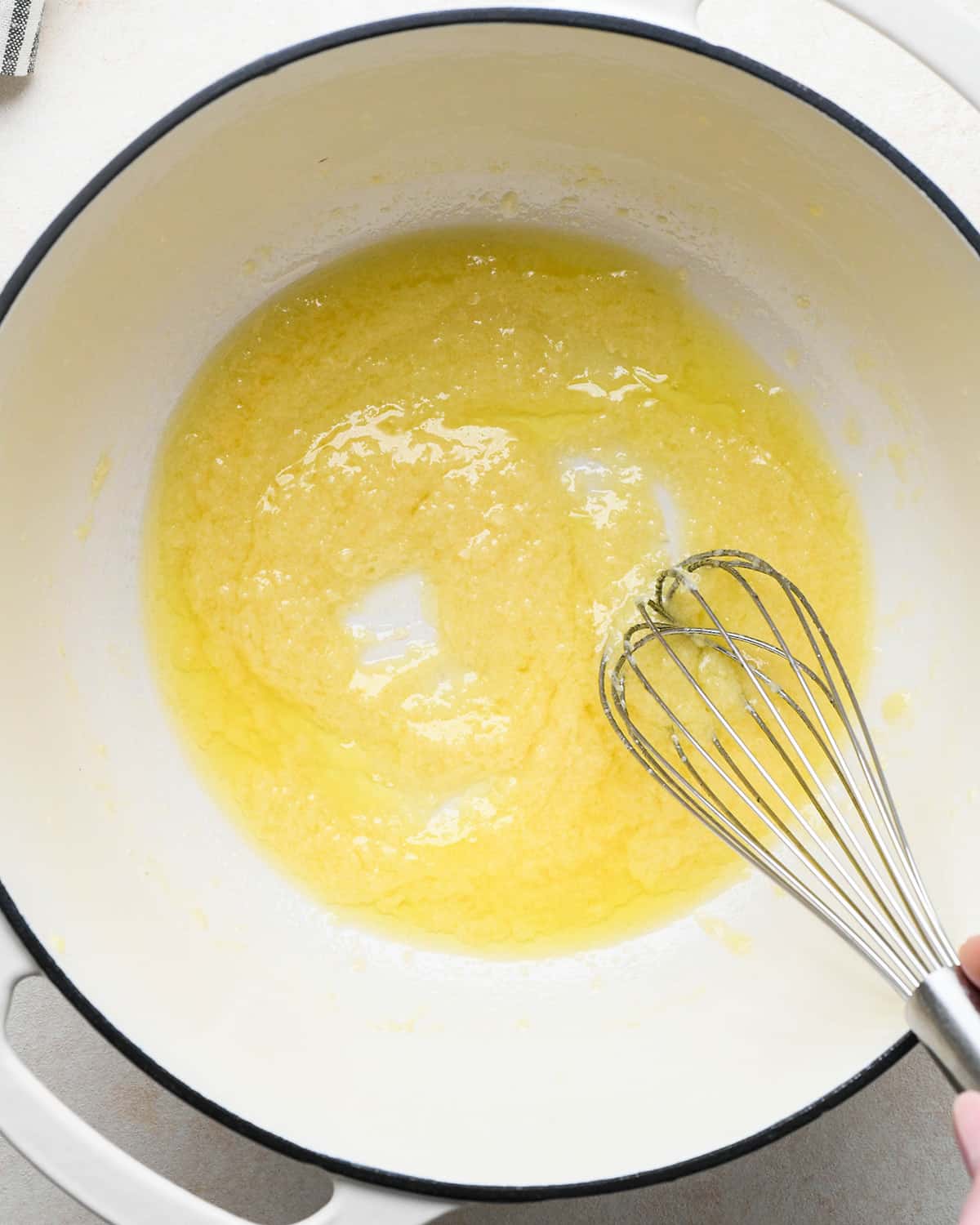 How to Make Parmesan Pasta - butter and parmesan cheese whisked together