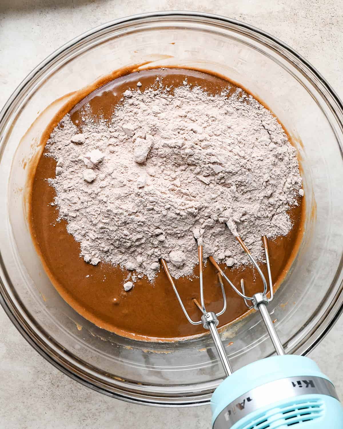 making Peanut Butter Cup Brownies - dry ingredients added before mixing