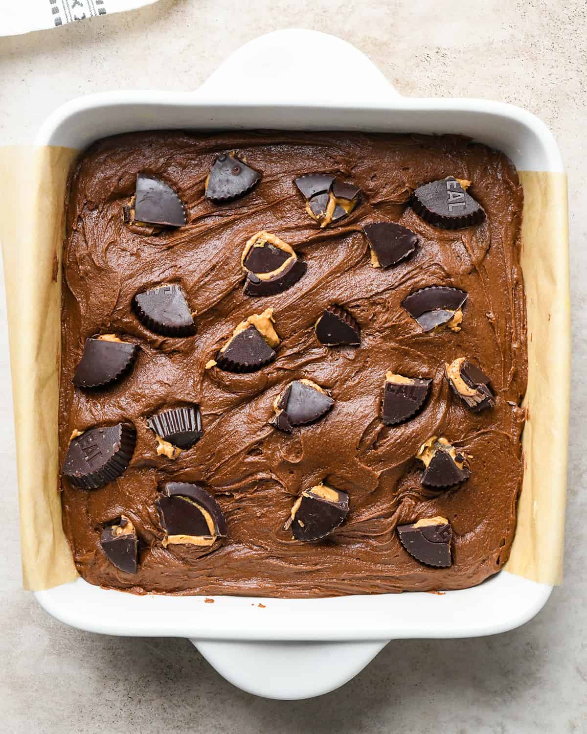 Peanut Butter Cup Brownies - chopped peanut butter cups on top of brownies before baking