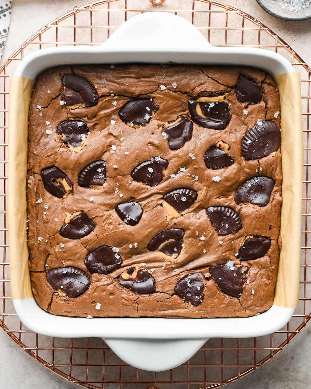 Peanut Butter Cup Brownies cooling on a wire cooling rack in the baking dish