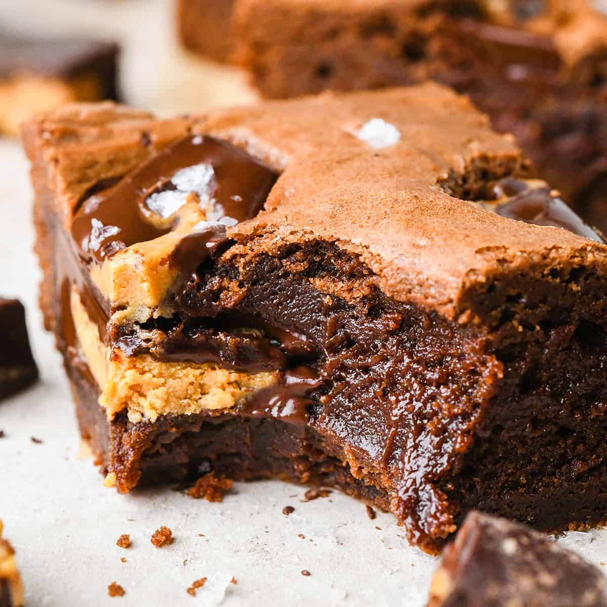 up close photo of a Peanut Butter Cup Brownie with a bite taken out of it