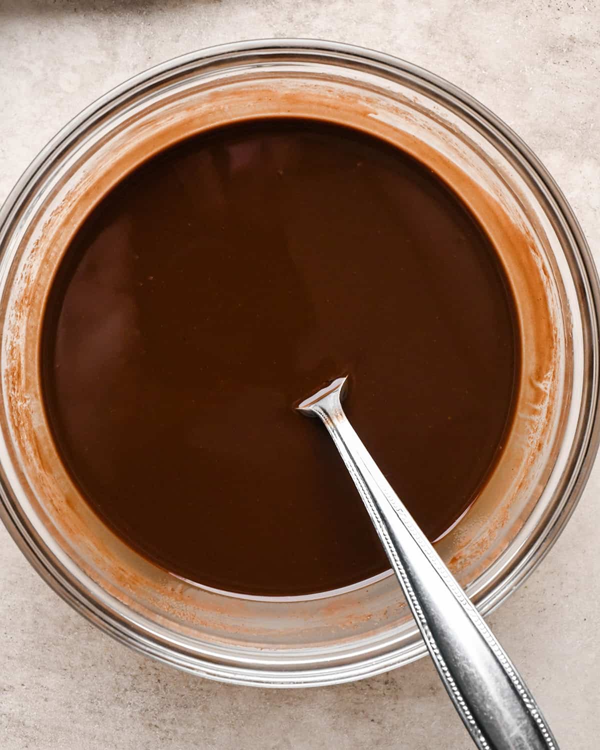 butter and chocolate in a glass bowl after melting