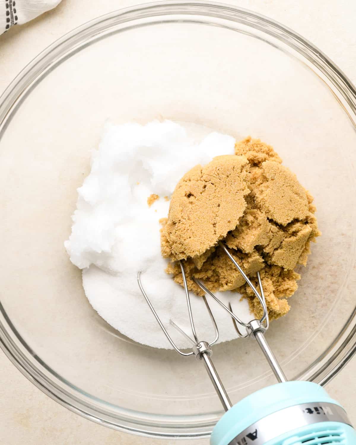 How to Make Vegan Chocolate Chip Cookies - coconut oil and sugars in a bowl before mixing