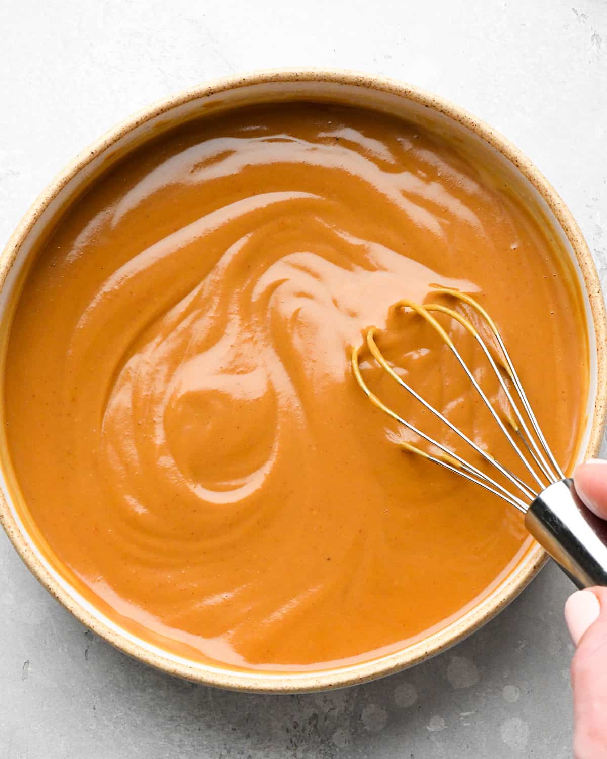 Chicken Satay peanut sauce in a bowl after whisking