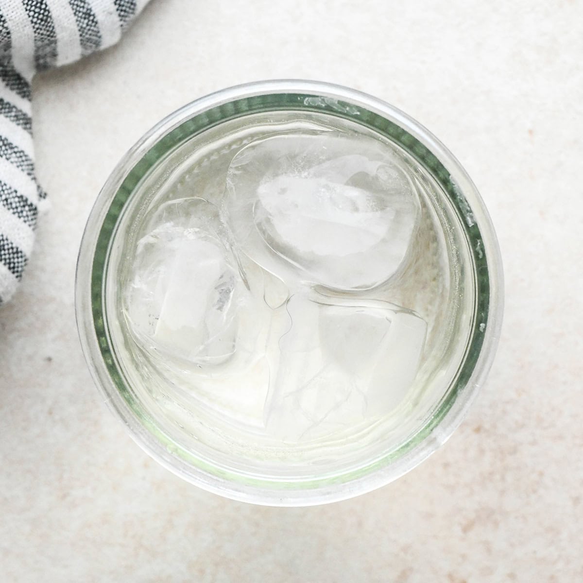 overhead photo of ice water in a jar