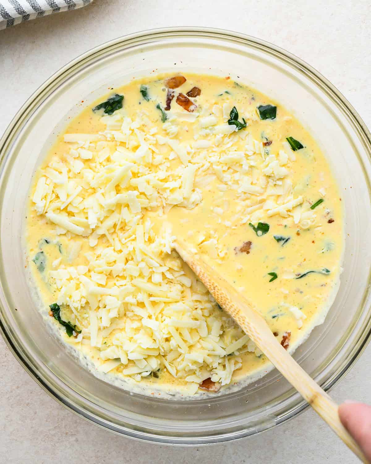 how to make quiche -adding bacon and cheese before stirring