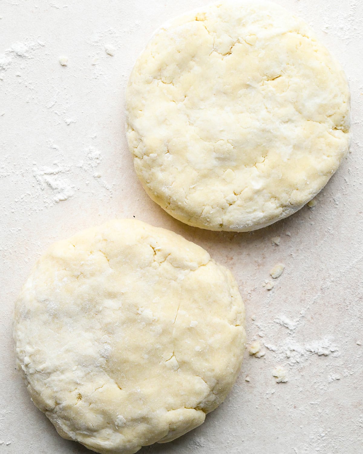quiche crust dough formed into two round discs